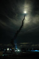 Flooding the night sky with light, Space Shuttle Discovery streaks through the clouds after liftoff from Launch Pad 39B on mission STS-116.